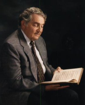 Portrait of Ira F. Brilliant holding a book